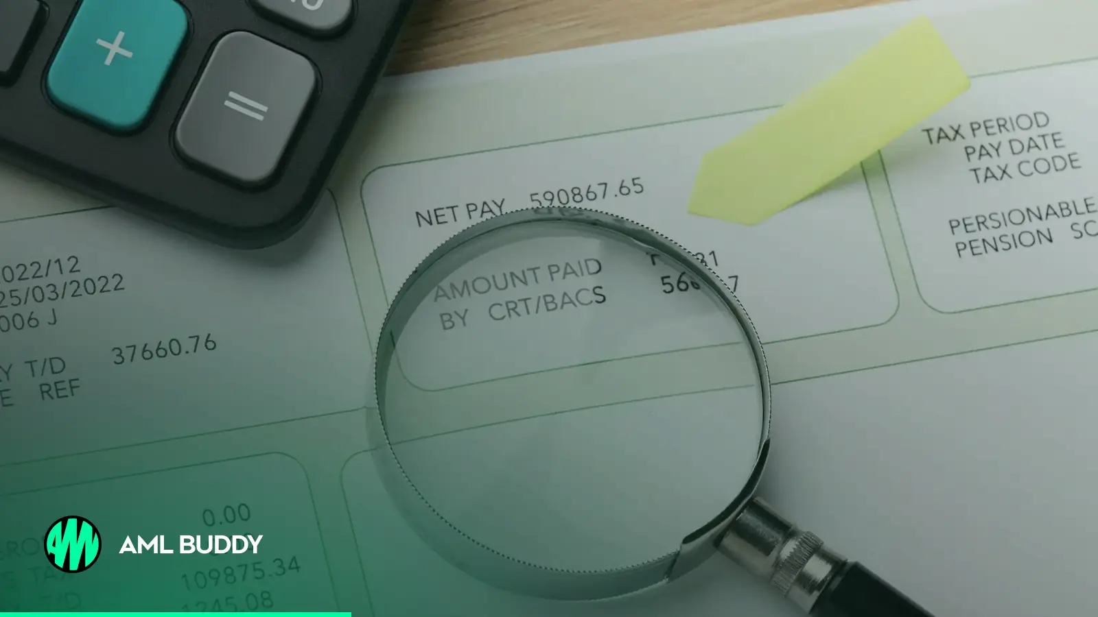 A magnifying glass over a payment document next to a calculator