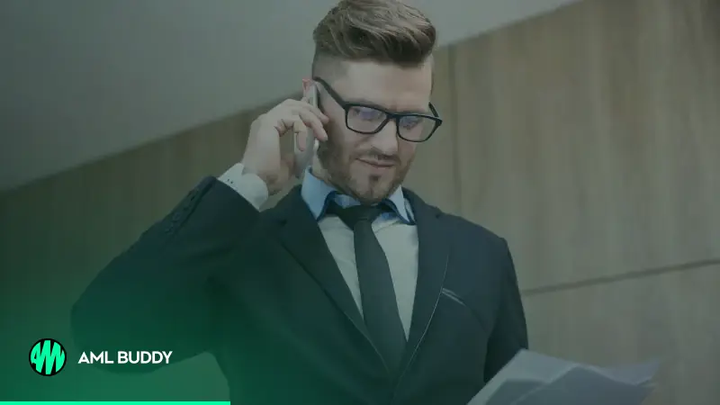 A professional reviewing client documents while on a phone call